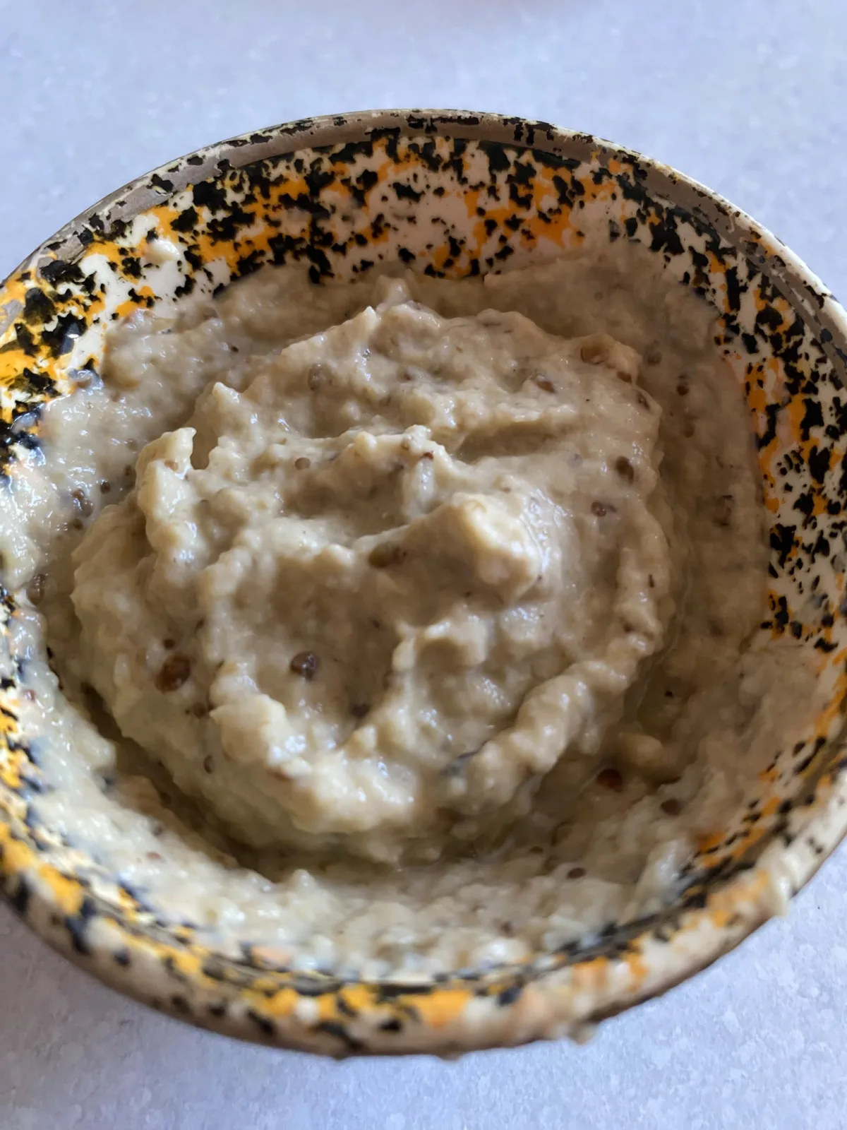 Smoky baba ganoush garnished with parsley and paprika
